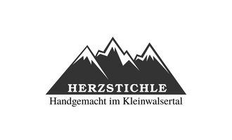A simple logo featuring mountain silhouettes. The text "HERZSTICHELE" stands for handmade products from Kleinwalsertal. | © Herzstichle Mittelberg Logo