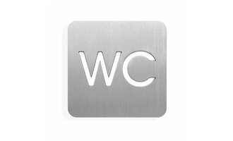Ein silbernes Schild mit der Beschriftung „WC“. Es zeigt an, dass es sich um eine Toilette handelt. | © Öffentliches WC