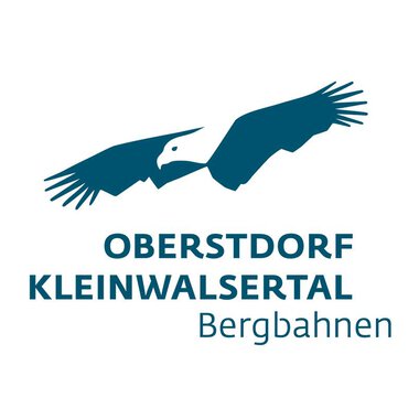 A logo with a stylized eagle and the inscription "Oberstdorf Kleinwalsertal Bergbahnen". It represents the mountain railways in the Oberstdorf and Kleinwalsertal region. | © OBERSTDORF · KLEINWALSERTAL BERGBAHNEN